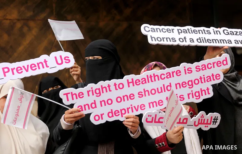 Palestinian Cancer patients take part in a protest to demand to travel for treatment, in Gaza city December 22, 2016. Photo by Mohammed Asad