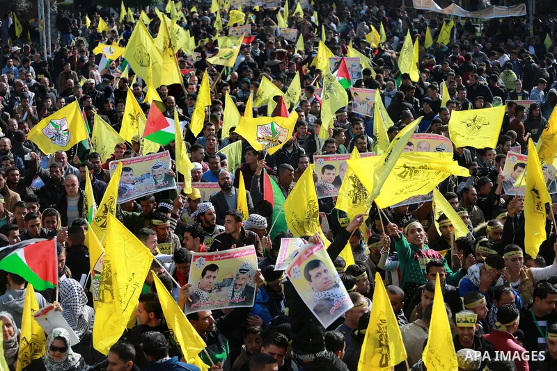 Palestinian supporters Fatah movement take part during a protest against the decision of the Palestinian President Mahmoud Abbas to strip members from Fatah of their Parliamentary Immunity, in Gaza city, on December 22,...