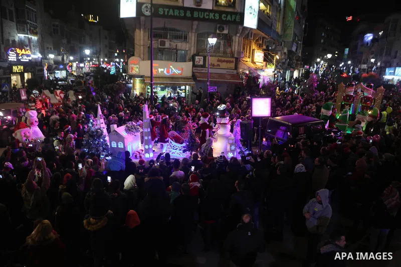 Palestinian Christians take part in Christmas convoy, in the West Bank city of Ramallah, ahead Christmas celebrations, on December 22, 2016. Photo by Shadi Hatem