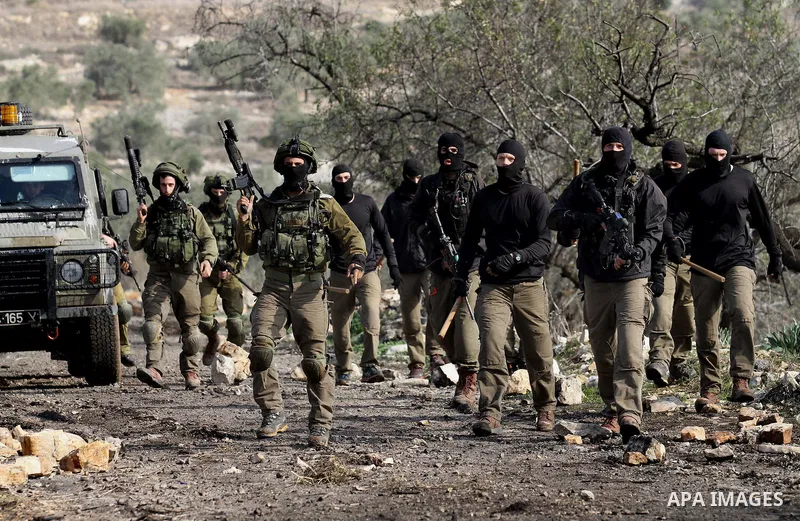 Israeli security forces take position near the settlement of Kadumim during clashes following a demonstration against the expropriation of Palestinian land by Israel in the village of Kfar Qaddum, in the occupied West Ba...