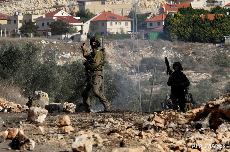 Israeli security forces take position near the settlement of Kadumim during clashes following a demonstration against the expropriation of Palestinian land by Israel in the village of Kfar Qaddum, in the occupied West Ba...