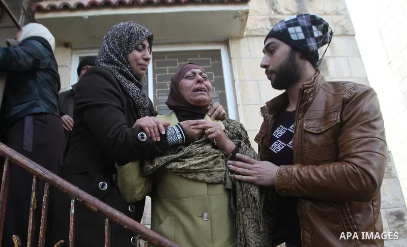 Relatives of Palestinian Jihad Khalil, who according to the Israeli police was shot and killed by an Israeli security guard after Khalil tried to stab him last November, mourn during his funeral after Israel released his...