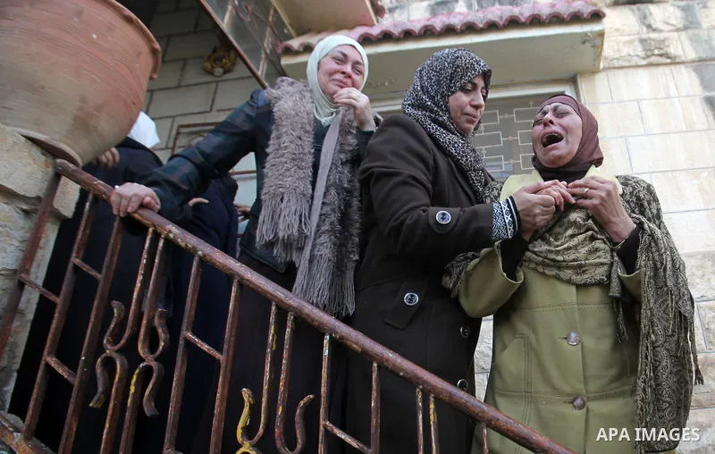 Relatives of Palestinian Jihad Khalil, who according to the Israeli police was shot and killed by an Israeli security guard after Khalil tried to stab him last November, mourn during his funeral after Israel released his...