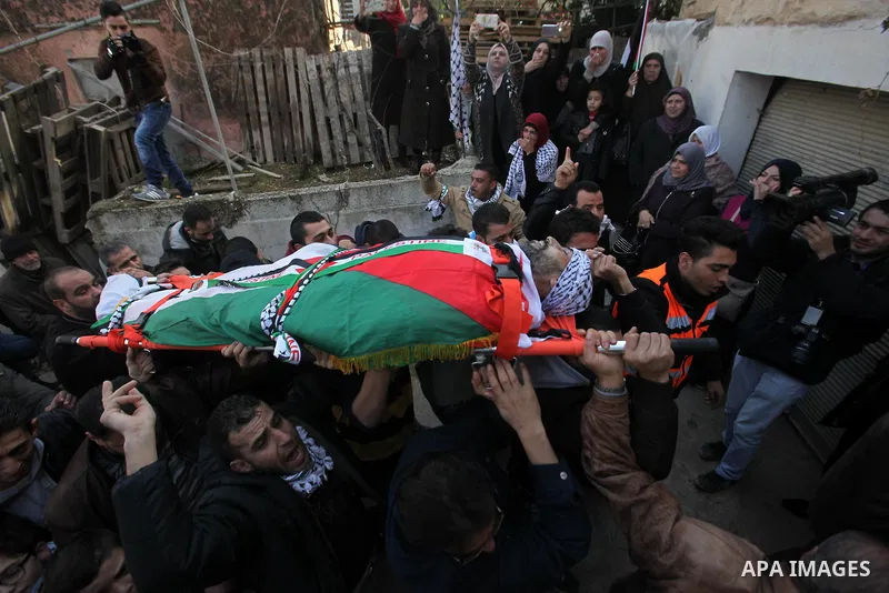 Mourners carry the body of Palestinian Jihad Khalil, who according to the Israeli police was shot and killed by an Israeli security guard after Khalil tried to stab him last November, during his funeral after Israel rele...