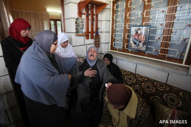 Relatives of Palestinian Jihad Khalil, who according to the Israeli police was shot and killed by an Israeli security guard after Khalil tried to stab him last November, mourn during his funeral after Israel released his...
