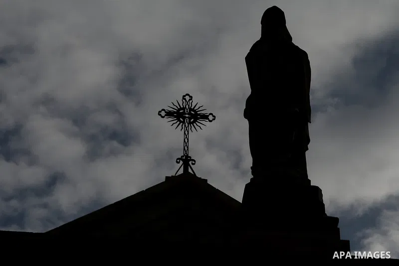 A Cross of the Church of the Nativity in seen as people gather for Christmas celebrations in the city of Bethlehem in the Israeli-occupied West Bank, on December 24, 2016. Photo by Shadi Hatem