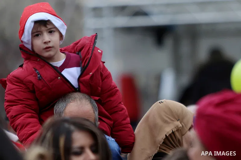 Palestinians attend a Christian scouts performance at the Manger Square outside the Church of the Nativity during Christmas celebrations in the city of Bethlehem in the Israeli-occupied West Bank, on December 24, 2016. P...