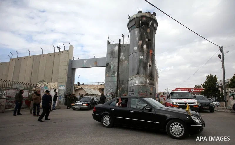 The Latin Patriarch of Jerusalem Pierbattista Pizzaballa is greeted upon his arrival through an Israeli checkpoint to attend Christmas celebrations, in the West Bank city of Bethlehem December 24, 2016. Photo by Wisam Ha...