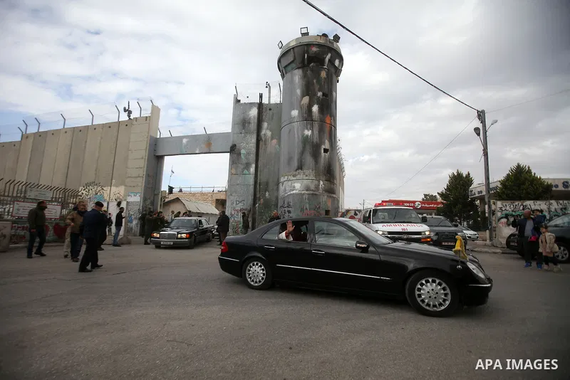 The Latin Patriarch of Jerusalem Pierbattista Pizzaballa is greeted upon his arrival through an Israeli checkpoint to attend Christmas celebrations, in the West Bank city of Bethlehem December 24, 2016. Photo by Wisam Ha...