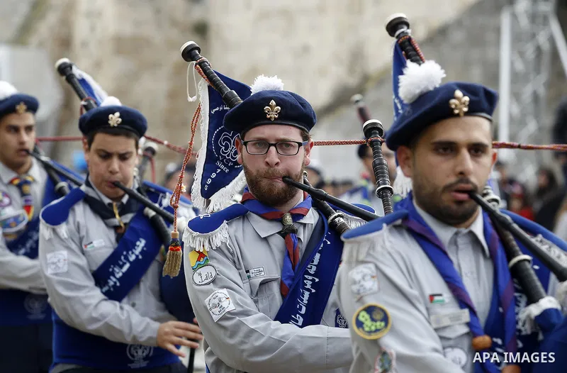 Palestinian Christian scouts perform at the Manger Square outside the Church of the Nativity as people gather for Christmas celebrations in the city of Bethlehem in the Israeli-occupied West Bank, on December 24, 2016. P...