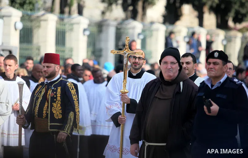 Clergymen wait for the arrival of the Latin Patriarch of Jerusalem Pierbattista Pizzaballa during Christmas celebrations, outside the Church of the Nativity in the West Bank city of Bethlehem December 24, 2016. Photo by...