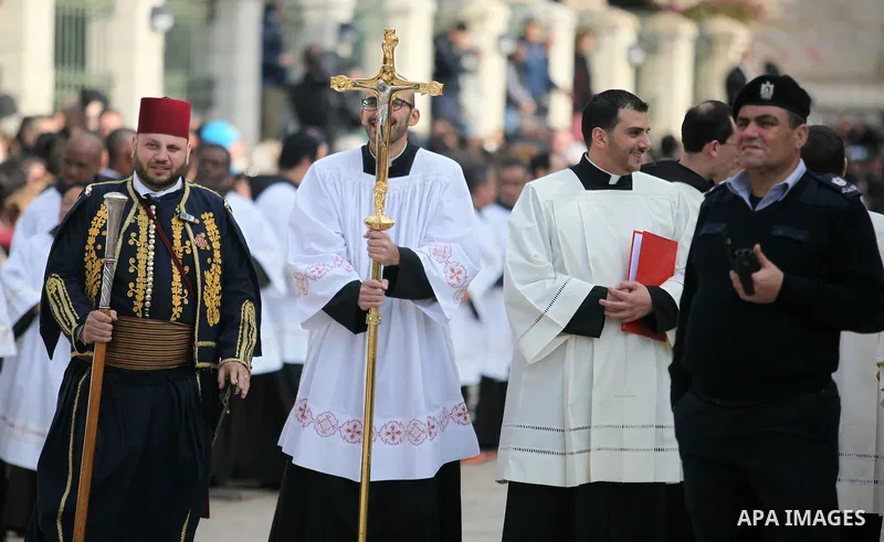 Clergymen wait for the arrival of the Latin Patriarch of Jerusalem Pierbattista Pizzaballa during Christmas celebrations, outside the Church of the Nativity in the West Bank city of Bethlehem December 24, 2016. Photo by...