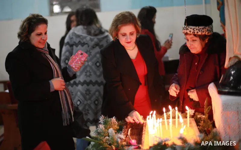 Palestinian Christians attend Christmas mass at the Holy Family Church, in Gaza City on December 24, 2016. Photo by Mohammed Asad
