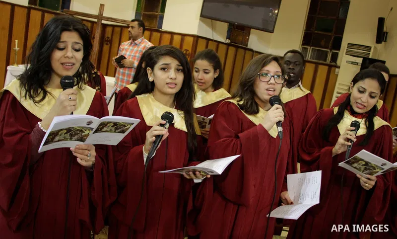 People attend Christmas Eve mass at the All Saints' Cathedral in Cairo, Egypt on December 24, 2016. Photo by Stringer