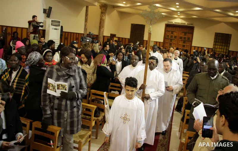 People attend Christmas Eve mass at the All Saints' Cathedral in Cairo, Egypt on December 24, 2016. Photo by Stringer