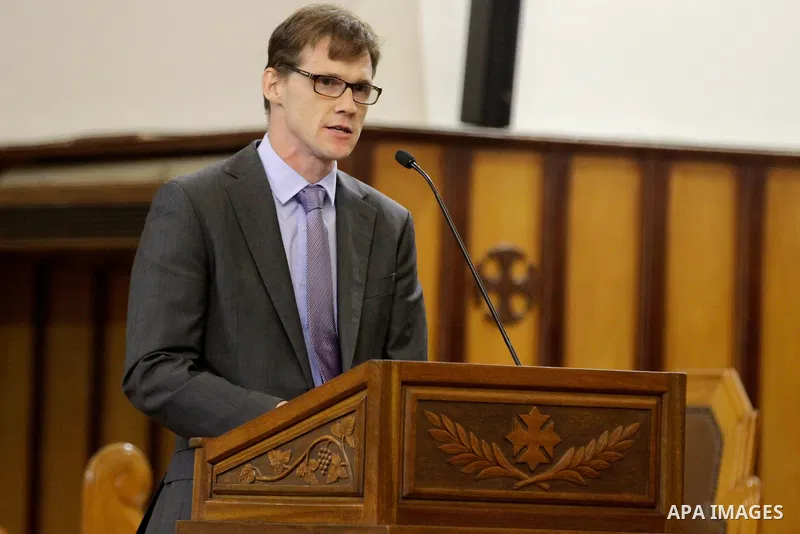 British Ambassador to Egypt John Casson attends Christmas Eve mass at the All Saints' Cathedral in Cairo, Egypt on December 24, 2016. Photo by Stringer