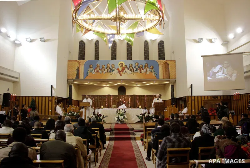 People attend Christmas Eve mass at the All Saints' Cathedral in Cairo, Egypt on December 24, 2016. Photo by Stringer