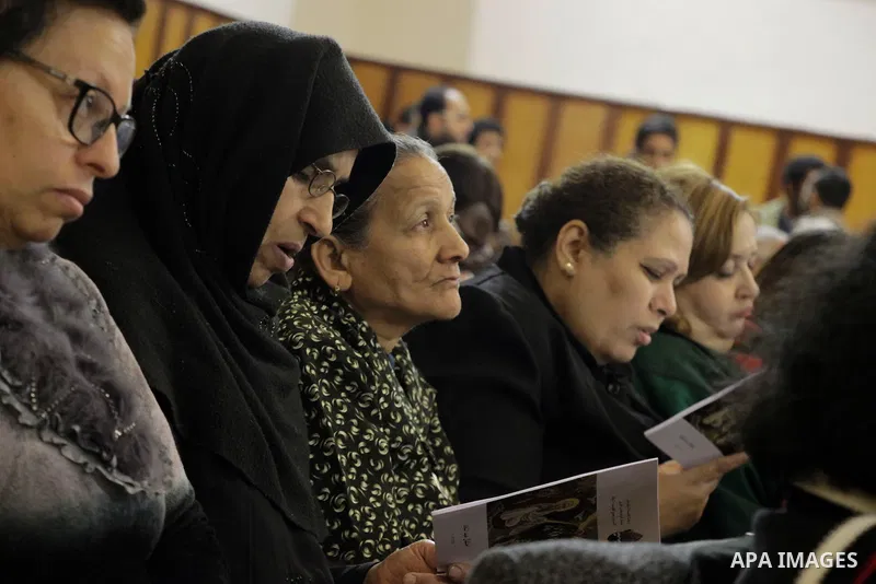 People attend Christmas Eve mass at the All Saints' Cathedral in Cairo, Egypt on December 24, 2016. Photo by Stringer