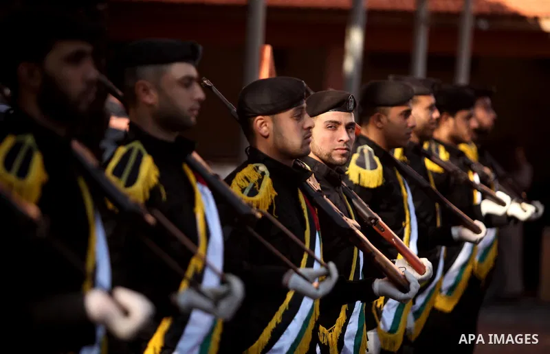 Members of the Palestinian Policemen stand guard in Deir al-Balah in central Gaza on December 26, 2016. Photo by Ashraf Amra
