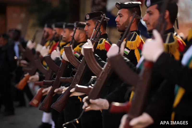 Members of the Palestinian Policemen stand guard in Deir al-Balah in central Gaza on December 26, 2016. Photo by Ashraf Amra