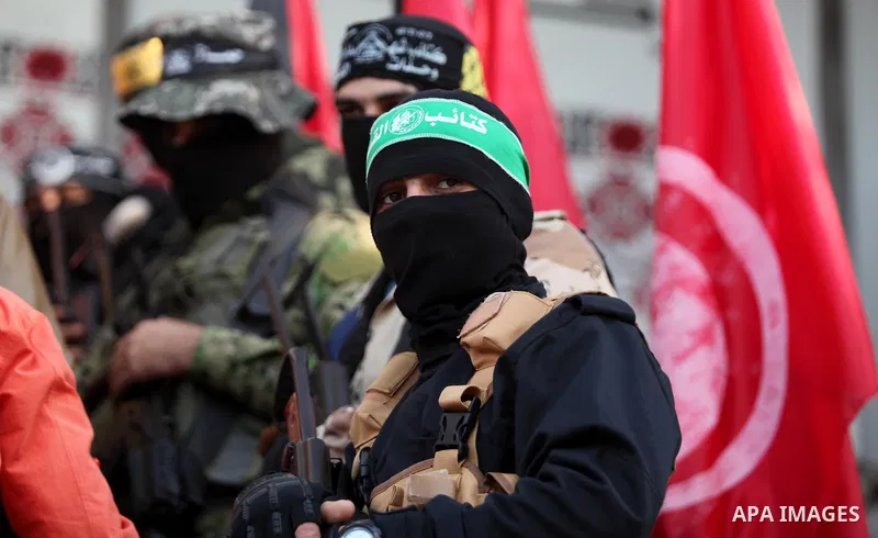 Palestinian members of Ezzedeen al-Qassam, the armed wing of Hamas movement, participate in a memorial service for a Tunisian Mohamed Zaouari, who was murdered in Tunisia in Gaza city on December 26, 2016. Zaouari, 49, w...