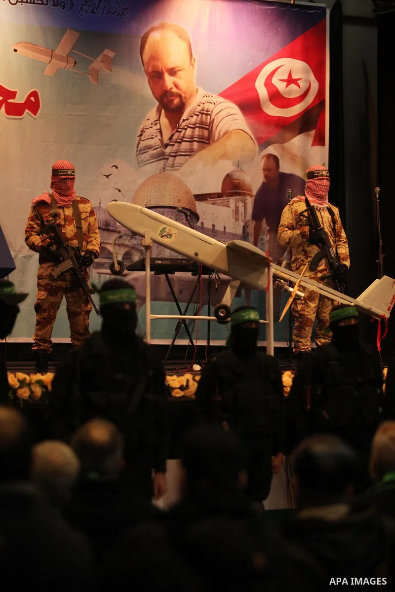 Palestinian members of Ezzedeen al-Qassam, the armed wing of Hamas movement, participate in a memorial service for a Tunisian Mohamed Zaouari, who was murdered in Tunisia in Gaza city on December 26, 2016. Zaouari, 49, w...