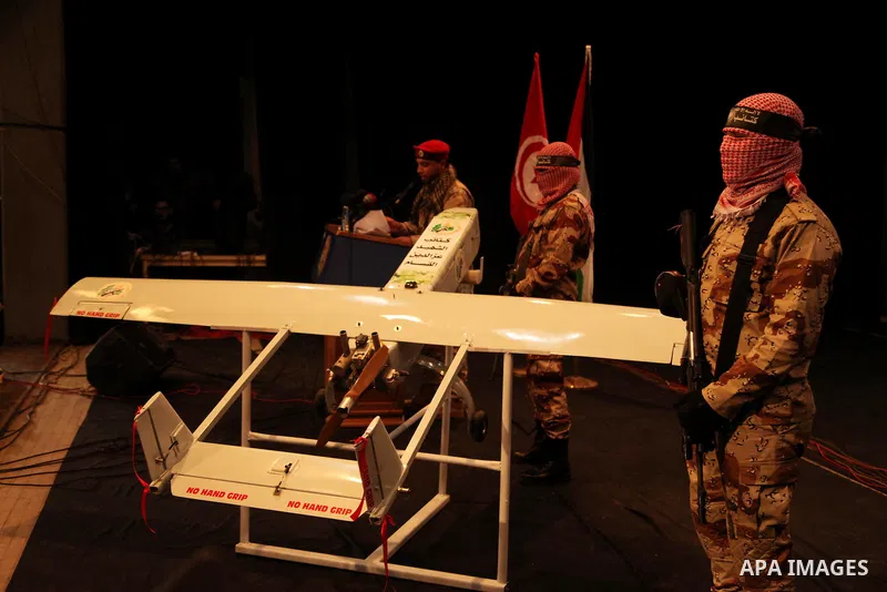 Palestinian members of Ezzedeen al-Qassam, the armed wing of Hamas movement, participate in a memorial service for a Tunisian Mohamed Zaouari, who was murdered in Tunisia in Gaza city on December 26, 2016. Zaouari, 49, w...