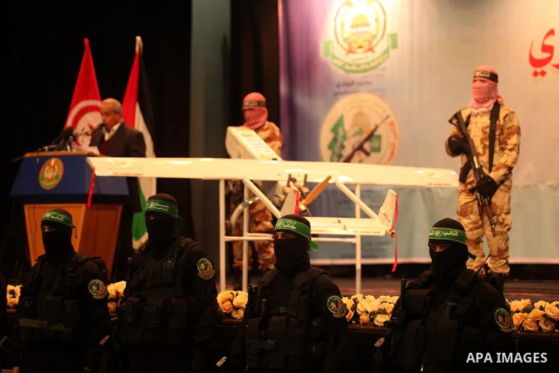 Palestinian members of Ezzedeen al-Qassam, the armed wing of Hamas movement, participate in a memorial service for a Tunisian Mohamed Zaouari, who was murdered in Tunisia in Gaza city on December 26, 2016. Zaouari, 49, w...