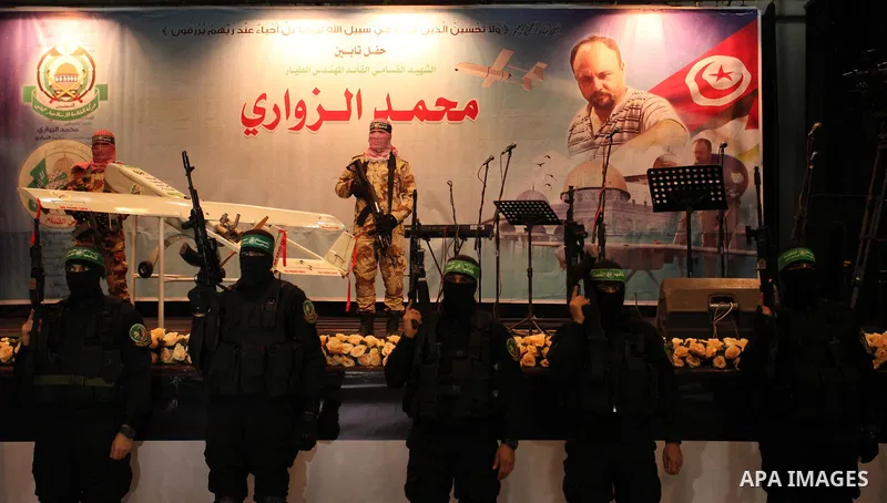 Palestinian members of Ezzedeen al-Qassam, the armed wing of Hamas movement, participate in a memorial service for a Tunisian Mohamed Zaouari, who was murdered in Tunisia in Gaza city on December 26, 2016. Zaouari, 49, w...
