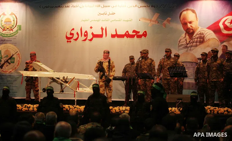 Palestinian members of Ezzedeen al-Qassam, the armed wing of Hamas movement, participate in a memorial service for a Tunisian Mohamed Zaouari, who was murdered in Tunisia in Gaza city on December 26, 2016. Zaouari, 49, w...