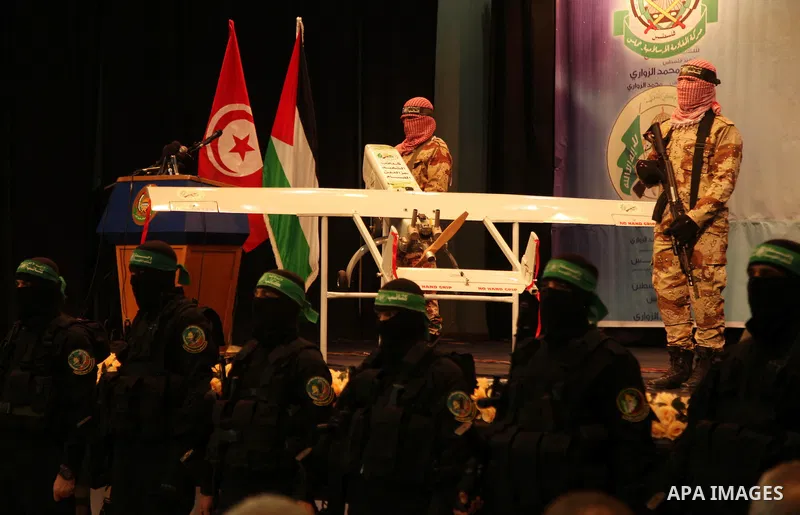 Palestinian members of Ezzedeen al-Qassam, the armed wing of Hamas movement, participate in a memorial service for a Tunisian Mohamed Zaouari, who was murdered in Tunisia in Gaza city on December 26, 2016. Zaouari, 49, w...