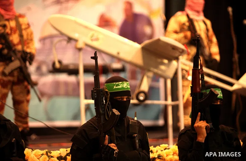 Palestinian members of Ezzedeen al-Qassam, the armed wing of Hamas movement, participate in a memorial service for a Tunisian Mohamed Zaouari, who was murdered in Tunisia in Gaza city on December 26, 2016. Zaouari, 49, w...
