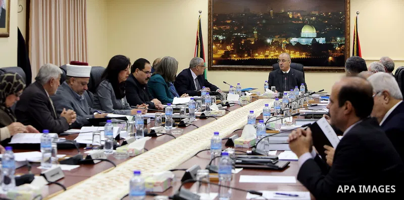 Palestinian Prime Minister, Rami Hamdallah, chairs a meeting of the council Ministers, in the West Bank city of Ramallah, on December 27, 2016. Photo by Prime Minister Office