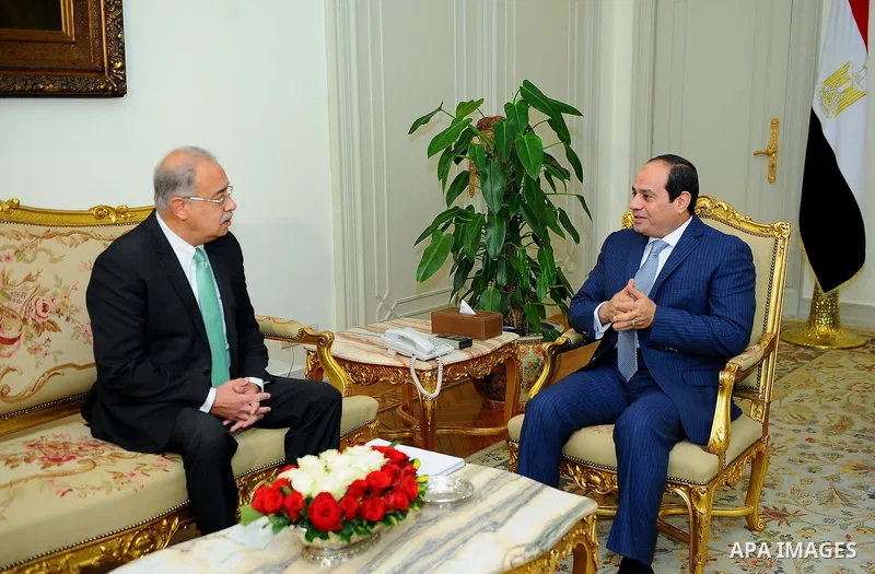Egyptian President Abdel Fattah al-Sisi meets with Egyptian Prime Minister Sharif Ismail, in Cairo, Egypt, on December 27, 2016. Photo by Egyptian President Office