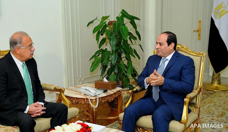Egyptian President Abdel Fattah al-Sisi meets with Egyptian Prime Minister Sharif Ismail, in Cairo, Egypt, on December 27, 2016. Photo by Egyptian President Office
