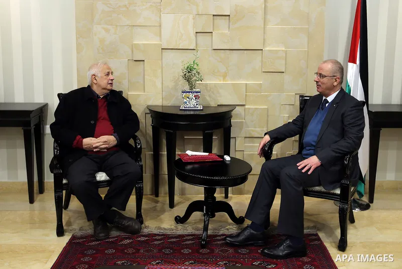 Palestinian Prime Minister, Rami Hamdallah, meets with the Palestinian chief of Election Commissioner, Hanna Nasser, in the West Bank city of Ramallah, on December 28, 2016. Photo by Prime Minister Office