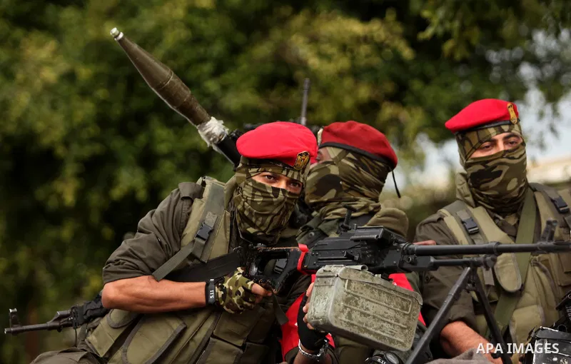 Palestinian security forces march during a rally marking the Eighth anniversary of the Israeli attack on Gaza strip in 2009, in Gaza city on December 28, 2016. Photo by Ashraf Amra