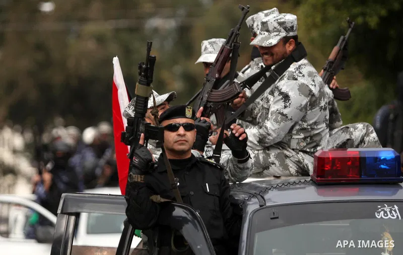 Palestinian police officers march during a rally marking the Eighth anniversary of the Israeli attack on Gaza strip in 2009, in Gaza city on December 28, 2016. Photo by Ashraf Amra