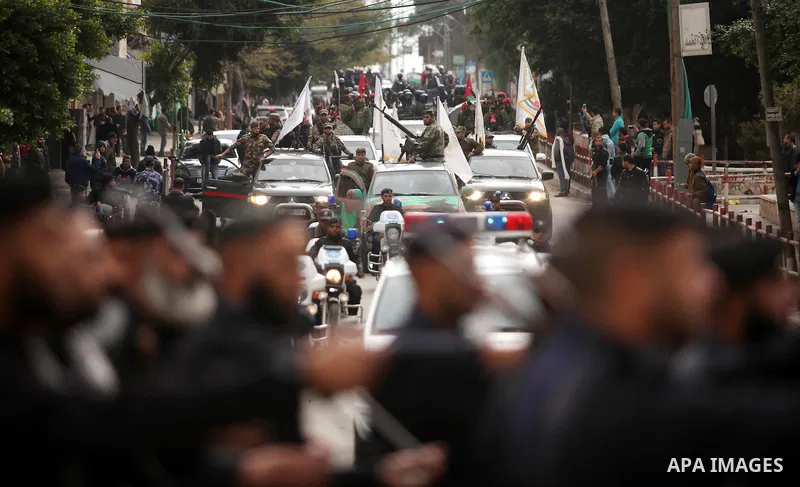 Palestinian police officers march during a rally marking the Eighth anniversary of the Israeli attack on Gaza strip in 2009, in Gaza city on December 28, 2016. Photo by Ashraf Amra