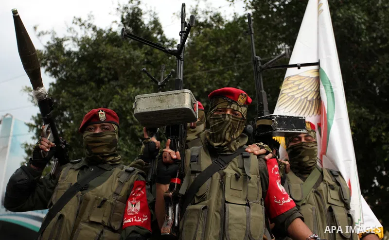 Palestinian security forces march during a rally marking the Eighth anniversary of the Israeli attack on Gaza strip in 2009, in Gaza city on December 28, 2016. Photo by Ashraf Amra
