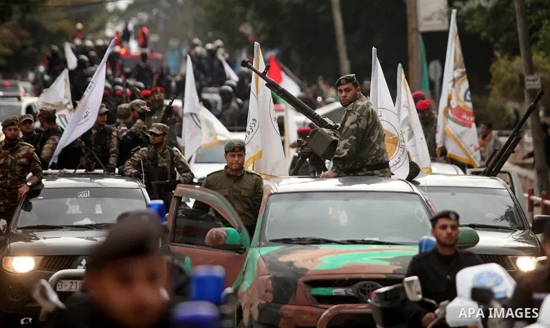 Palestinian security forces march during a rally marking the Eighth anniversary of the Israeli attack on Gaza strip in 2009, in Gaza city on December 28, 2016. Photo by Ashraf Amra