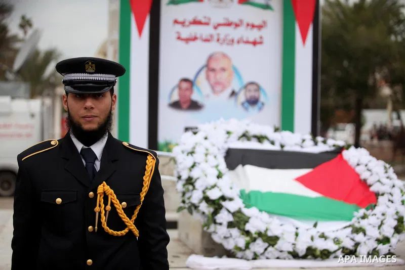 Palestinian police officers lays a wreath at the tomb of the Unknown Soldier during a rally marking the Eighth anniversary of the Israeli attack on Gaza strip in 2009, in Gaza city on December 28, 2016. Photo by Ashraf A...