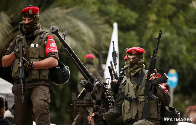 Palestinian security forces march during a rally marking the Eighth anniversary of the Israeli attack on Gaza strip in 2009, in Gaza city on December 28, 2016. Photo by Ashraf Amra