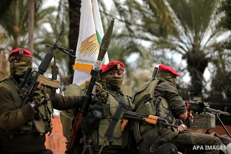 Palestinian security forces march during a rally marking the Eighth anniversary of the Israeli attack on Gaza strip in 2009, in Gaza city on December 28, 2016. Photo by Ashraf Amra