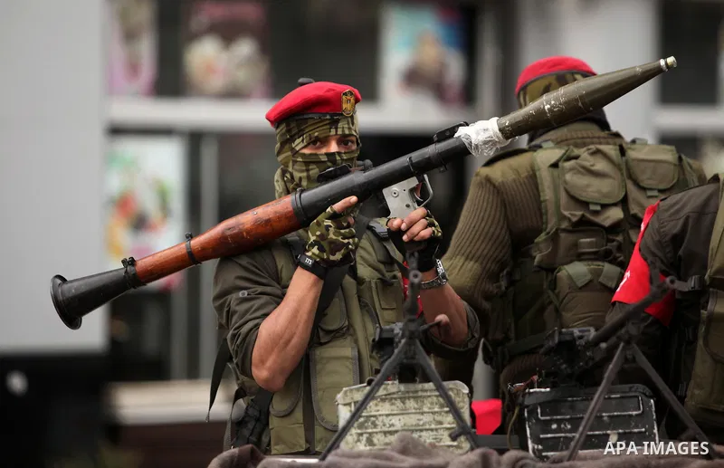 Palestinian security forces march during a rally marking the Eighth anniversary of the Israeli attack on Gaza strip in 2009, in Gaza city on December 28, 2016. Photo by Ashraf Amra