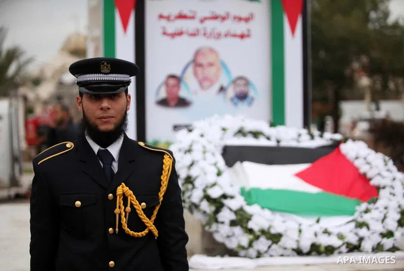 Palestinian police officers lays a wreath at the tomb of the Unknown Soldier during a rally marking the Eighth anniversary of the Israeli attack on Gaza strip in 2009, in Gaza city on December 28, 2016. Photo by Ashraf A...