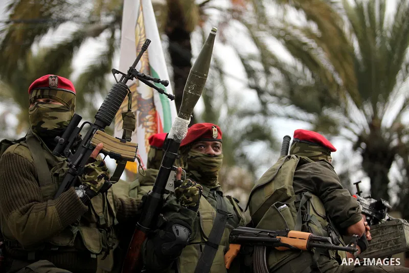 Palestinian security forces march during a rally marking the Eighth anniversary of the Israeli attack on Gaza strip in 2009, in Gaza city on December 28, 2016. Photo by Ashraf Amra