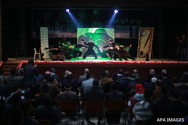 Palestinians attend the operetta entitled "camera and pen" during the events on the al-Wafa' of the Palestinian journalist, in Gaza city on December 29, 2016. Photo by Mohammed Asad