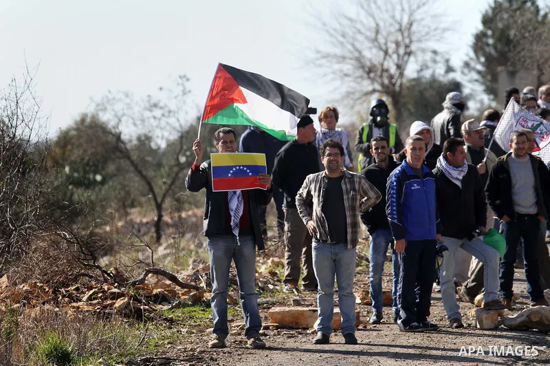 Palestinian protesters clash with Israeli security forces following a demonstration against the expropriation of Palestinian land by Israel in the village of Kfar Qaddum, near Nablus, in the occupied West Bank on Decembe...