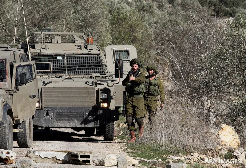 Israeli security forces fire teargas canisters towards Palestinian protesters following a demonstration against the expropriation of Palestinian land by Israel in the village of Kfar Qaddum, near Nablus, in the occupied...